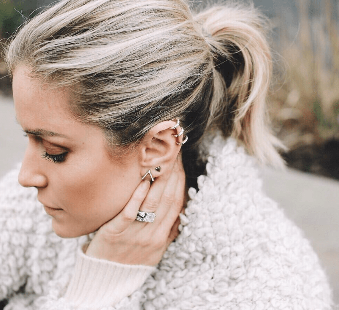 Kristin Cavallari' looks to the Side to show off her earrings