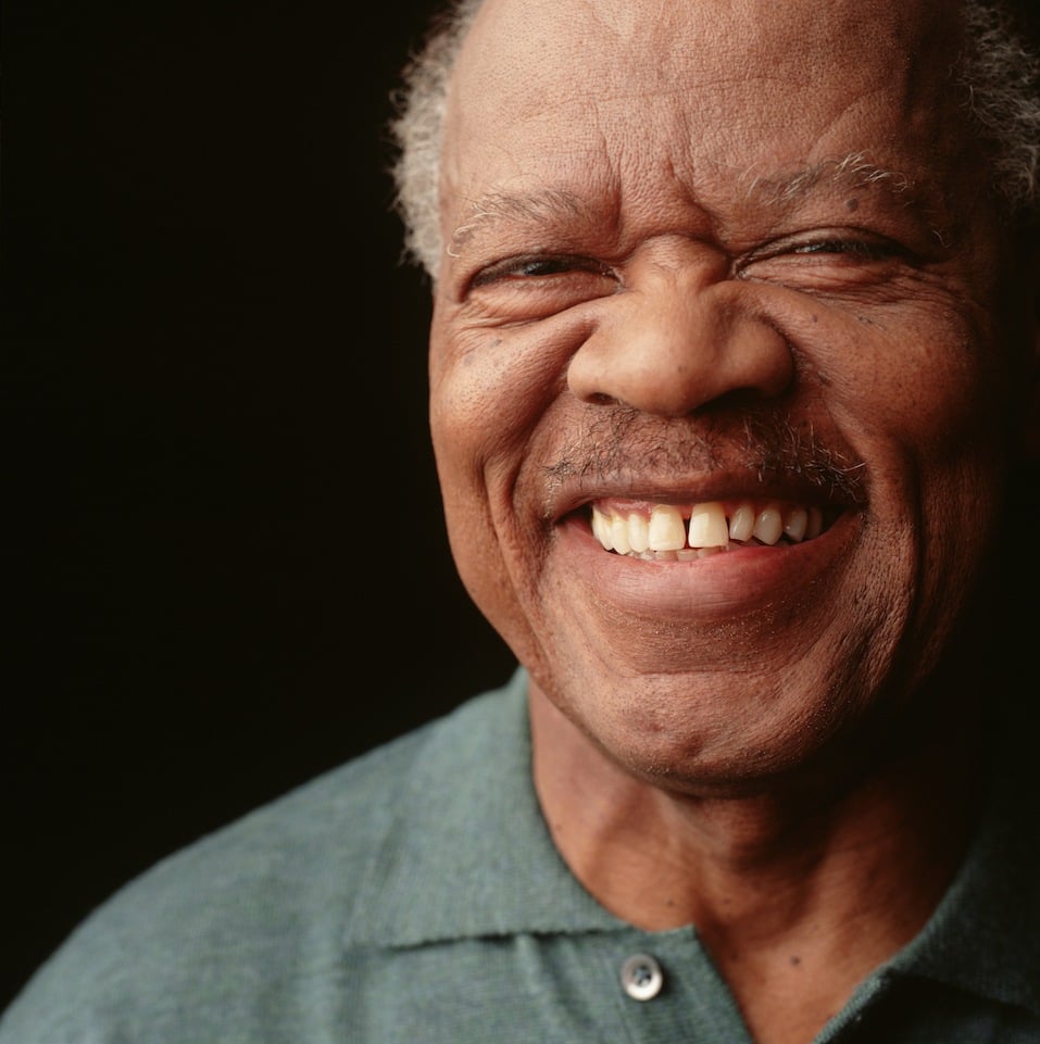 Senior man with moustache and toothy smile