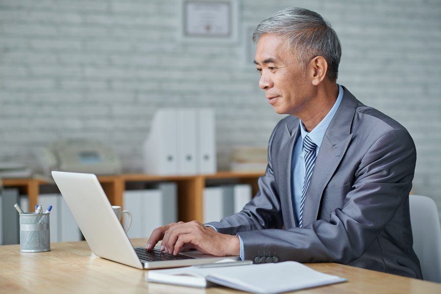 Senior working on computer
