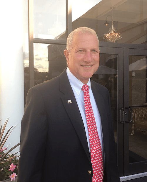 Mark Lauretti in a black suit and tie. Mark Lauretti in a black suit and tie.