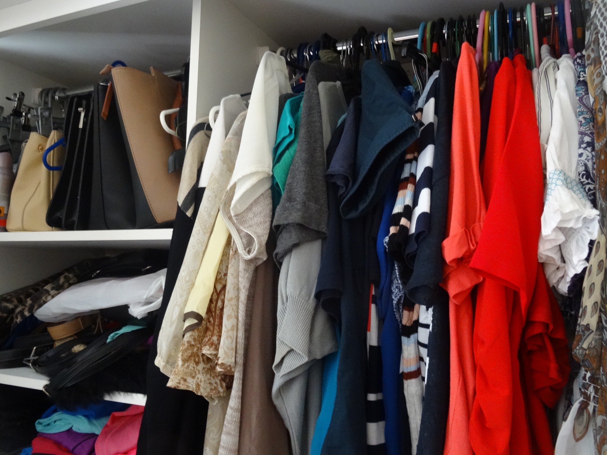 Overstuffed clothing in wardrobe or closet