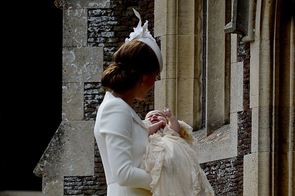 Catherine, Duchess of Cambridge and Princess Charlotte of Cambridge arrive at the Church of St Mary Magdalene on the Sandringham Estate for the Christening of Princess Charlotte of Cambridge