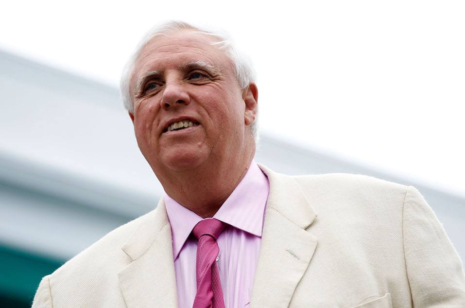 Jim Justice, owner of the Greenbrier Resort, looks over the 18th green