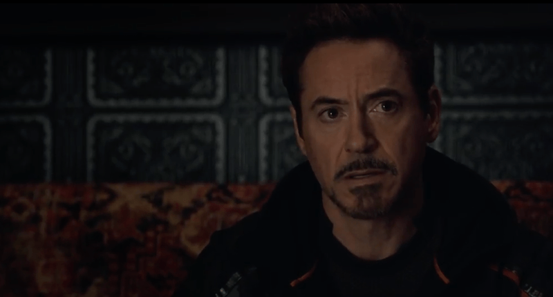 Tony Stark sitting in a dark room. 