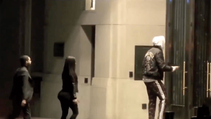 Tristian being followed by a woman and man as he enters a hotel. Tristian being followed by a woman and man as he enters a hotel.