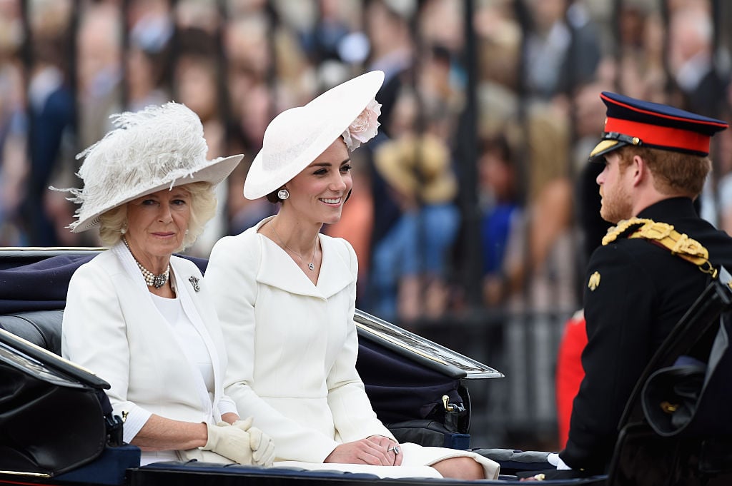 Camilla, Duchess of Cornwall, Catherine, Duchess of Cambridge and Prince Harry sit in a carriage during the Trooping the Colour, this year marking the Queen's 90th birthday at The Mall