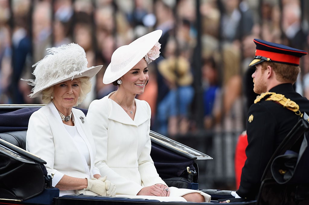 Camilla, Duchess of Cornwall, Catherine, Duchess of Cambridge and Prince Harry sit in a carriage during the Trooping the Colour, this year marking the Queen's 90th birthday at The Mall Camilla, Duchess of Cornwall, Catherine, Duchess of Cambridge and Prince Harry sit in a carriage during the Trooping the Colour, this year marking the Queen's 90th birthday at The Mall