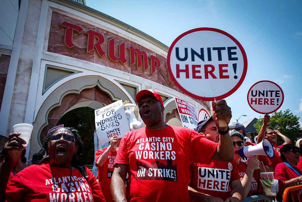 Union workers from local 54 take part in a rally outside the Trump Taj Mahal in Atlantic City