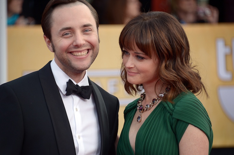 Vincent Kartheiser and Alexis Bledel posing for the paparazzi on a red carpet. Vincent Kartheiser and Alexis Bledel posing for the paparazzi on a red carpet.