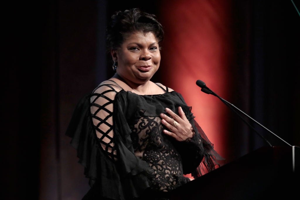 Journalist April Ryan accepts the WMC She Persisted Award onstage