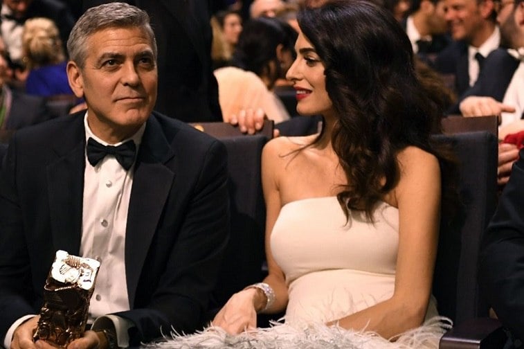 US actor George Clooney and his British-Lebanese lawyer Amal Clooney speak during the 42nd edition of the Cesar Ceremony at the Salle Pleyel in Paris on February 24, 2017. US actor George Clooney and his British-Lebanese lawyer Amal Clooney speak during the 42nd edition of the Cesar Ceremony at the Salle Pleyel in Paris on February 24, 2017.
