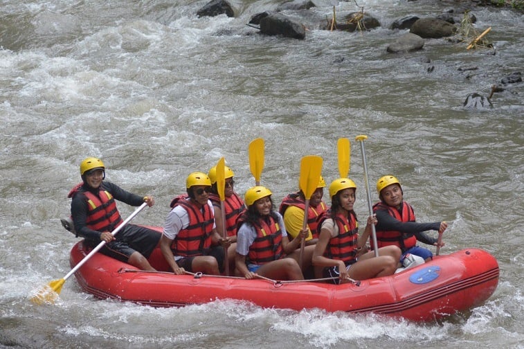 Former US president Barack Obama (2nd L), his wife Michelle (3rd L) and his daughters Sasha (front C) and Malia (2nd R) go rafting at Bongkasa Village in Badung on Bali island on June 26, 2017. Former US president Barack Obama (2nd L), his wife Michelle (3rd L) and his daughters Sasha (front C) and Malia (2nd R) go rafting at Bongkasa Village in Badung on Bali island on June 26, 2017.