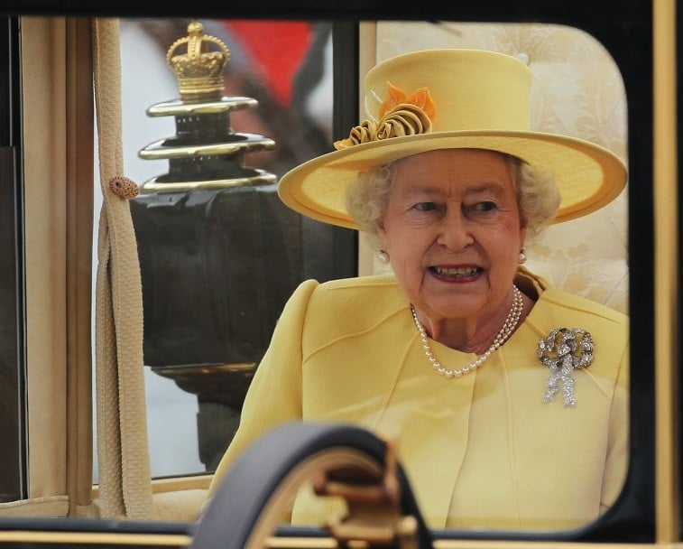 Queen Elizabeth II enters to ride in a carriage procession to Buckingham Palace Queen Elizabeth II enters to ride in a carriage procession to Buckingham Palace following the marriage of Their Royal Highnesses Prince William Duke of Cambridge and Catherine Duchess of Cambridge at Westminster Abbey on April 29, 2011 in London, England.