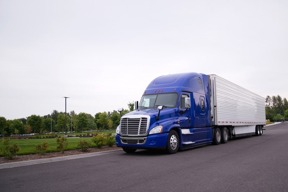 Bright blue modern popular huge comfortable big rig semi truck