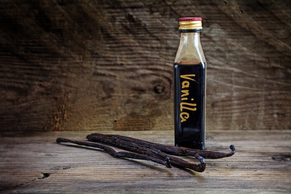 vanilla extract in a bottle and pods