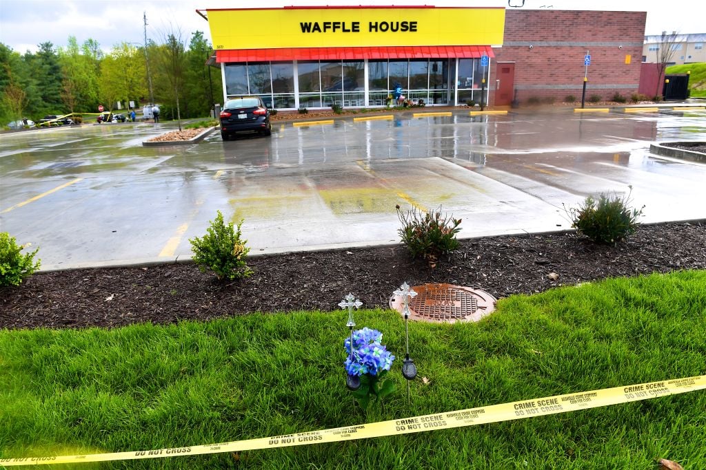Community members create makeshift memorials for and stop by to pay respects to the victims of the Waffle House shooting on April 24, 2018 in Antioch, Tennessee.