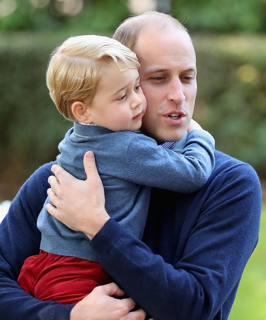 Prince George of Cambridge with Prince William, Duke of Cambridge at a children's party for Military families
