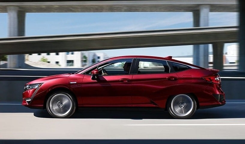 Red Clarity Plug-in Hybrid on the highway