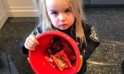 Donald Trump Jr.'s daughter holding a bucket of candy Donald Trump Jr.'s daughter holding a bucket of candy