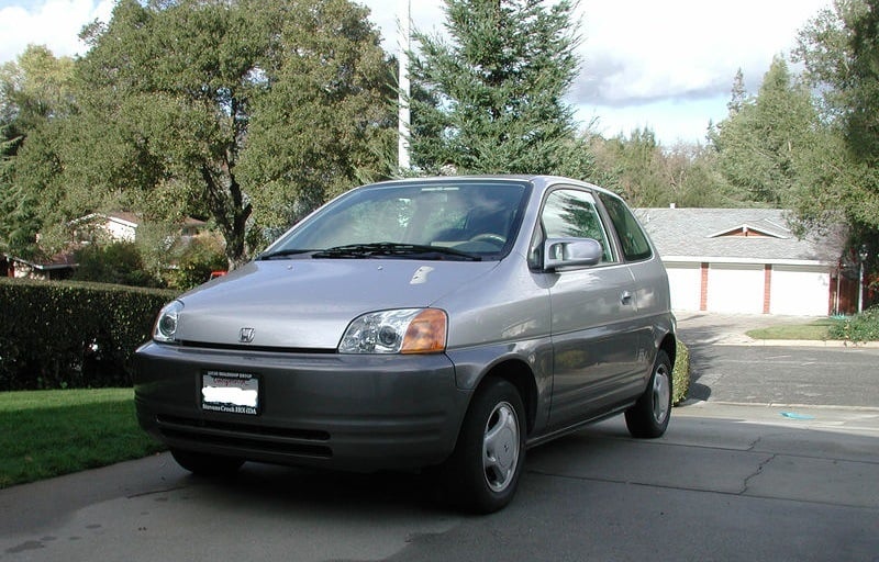 A late '90 Honda EV Plus electric car in a driveway