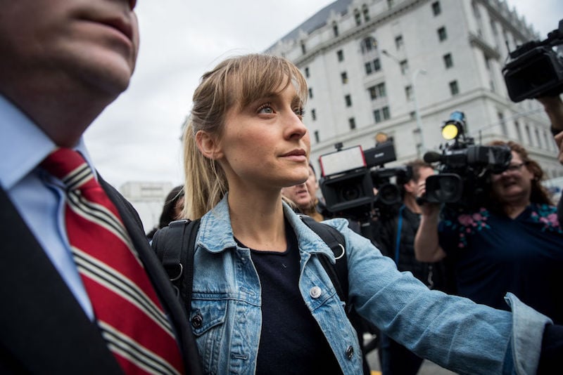 Allison Mack being interviewed by reporters. Allison Mack being interviewed by reporters.