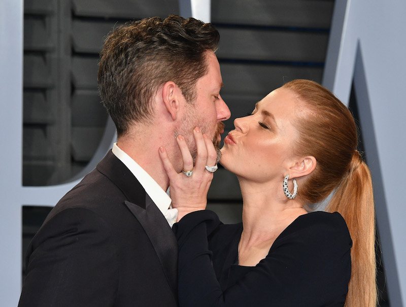 Darren Le Gallo and Amy Adams kissing for the paparazzi. 