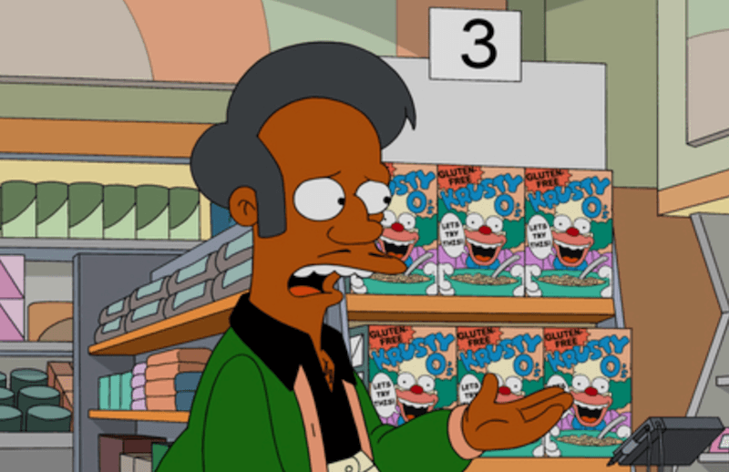 Apu talking to a customer inside his market. Apu talking to a customer inside his market.