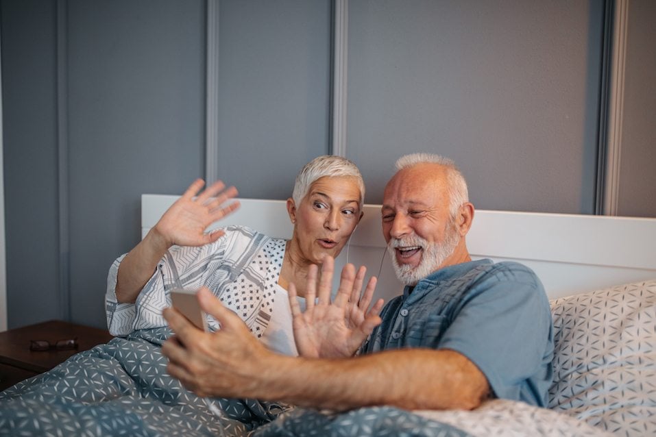 A senior couple talking with loved ones