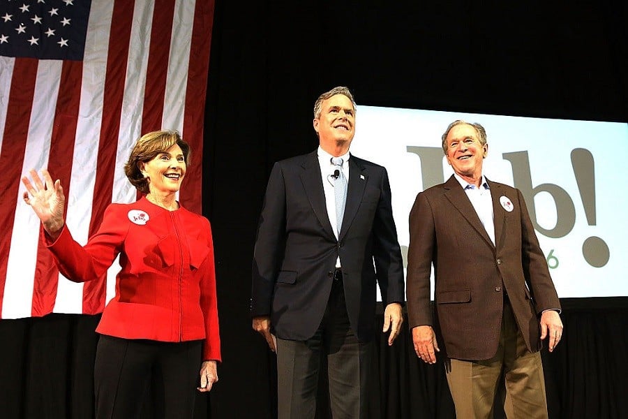 Jeb Bush (C) stands with his brother, former President George W. Bush (R) and former First Lady Laura Bush (L) at a campaign rally on February 15, 2016 in North Charleston, South Carolina.