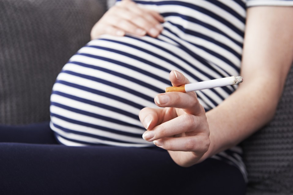 Pregnant Woman Smoking Cigarette