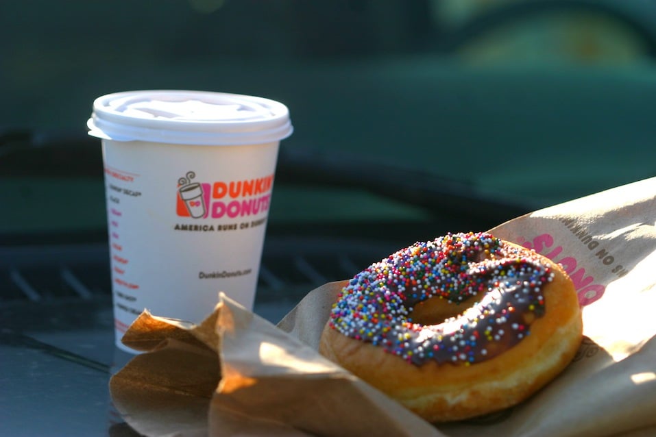 A Dunkin' Donuts coffee and doughnut.