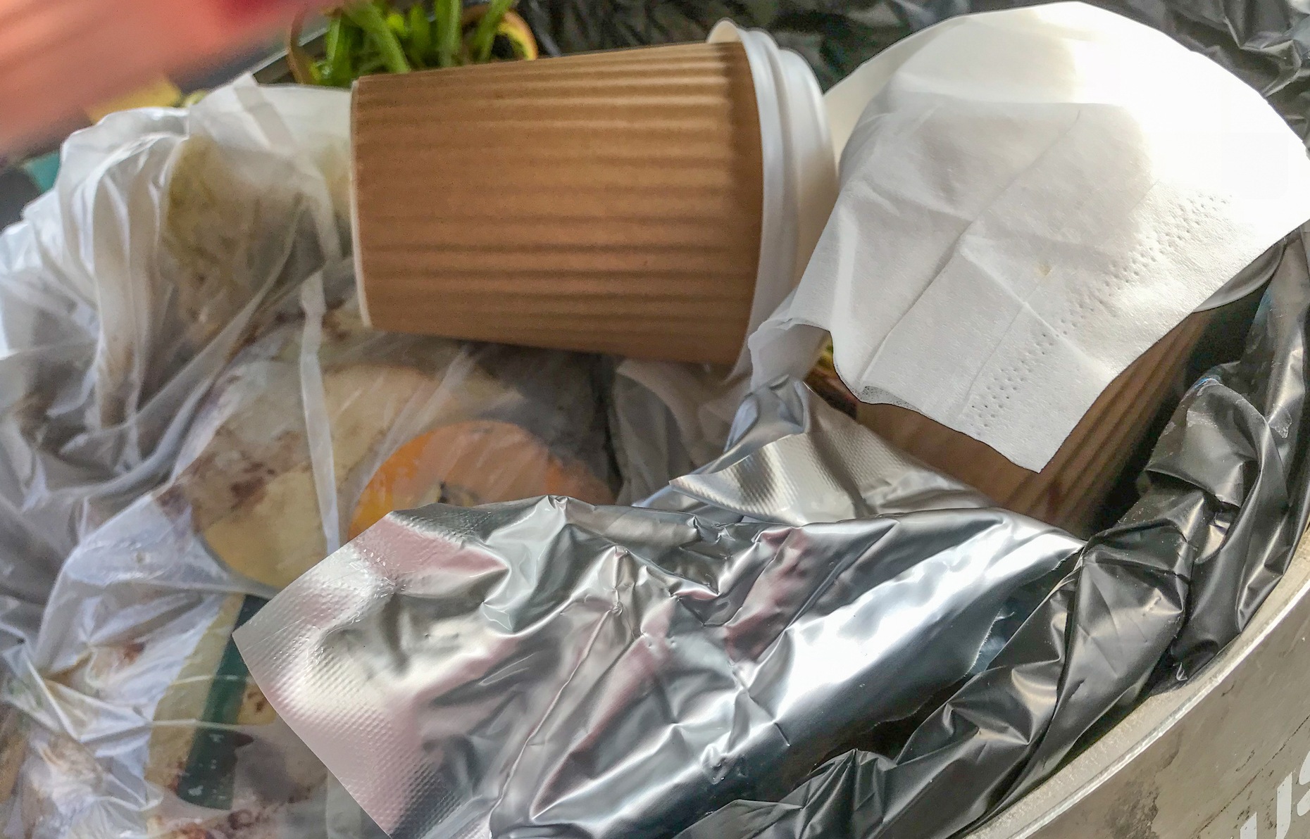 Coffee cups in trash