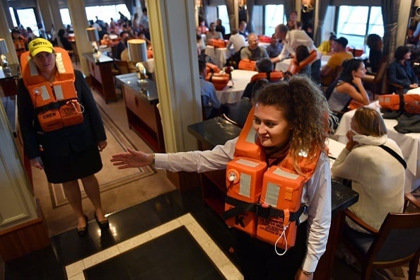 Passengers wear life jackets during a security exercise aboard the British cruise ship