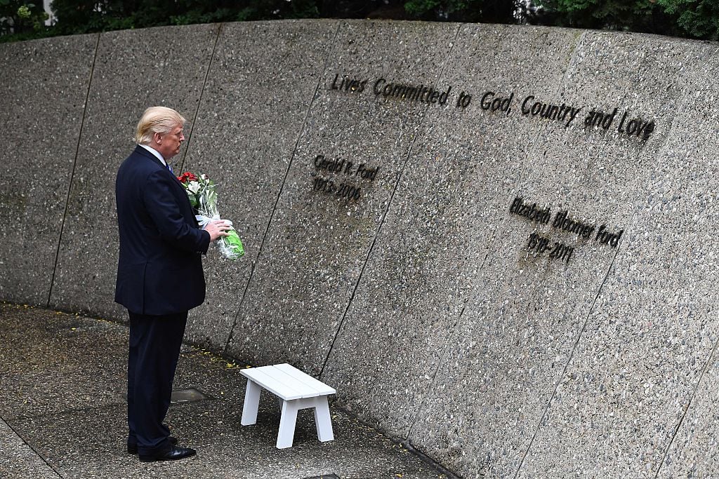 US Republican presidential nominee Donald Trump pays his respect at the former US President Gerald Ford