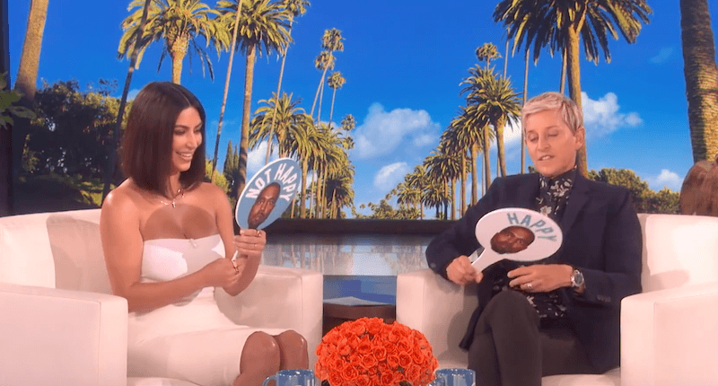 Kim Kardashian West sitting and playing a game with Ellen DeGeneres. 