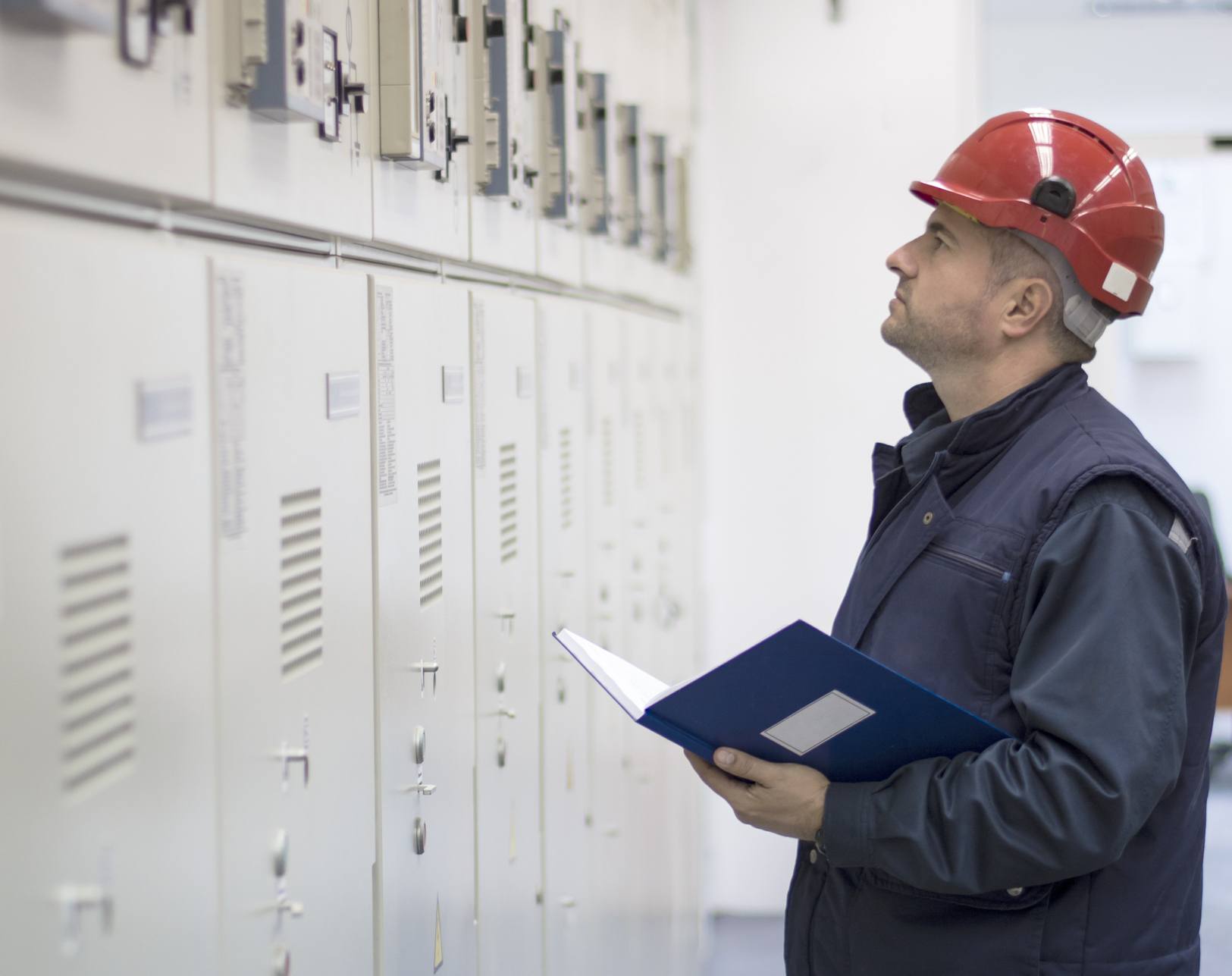 Technician Checks the Functionality of the Equipment in Electrical Room