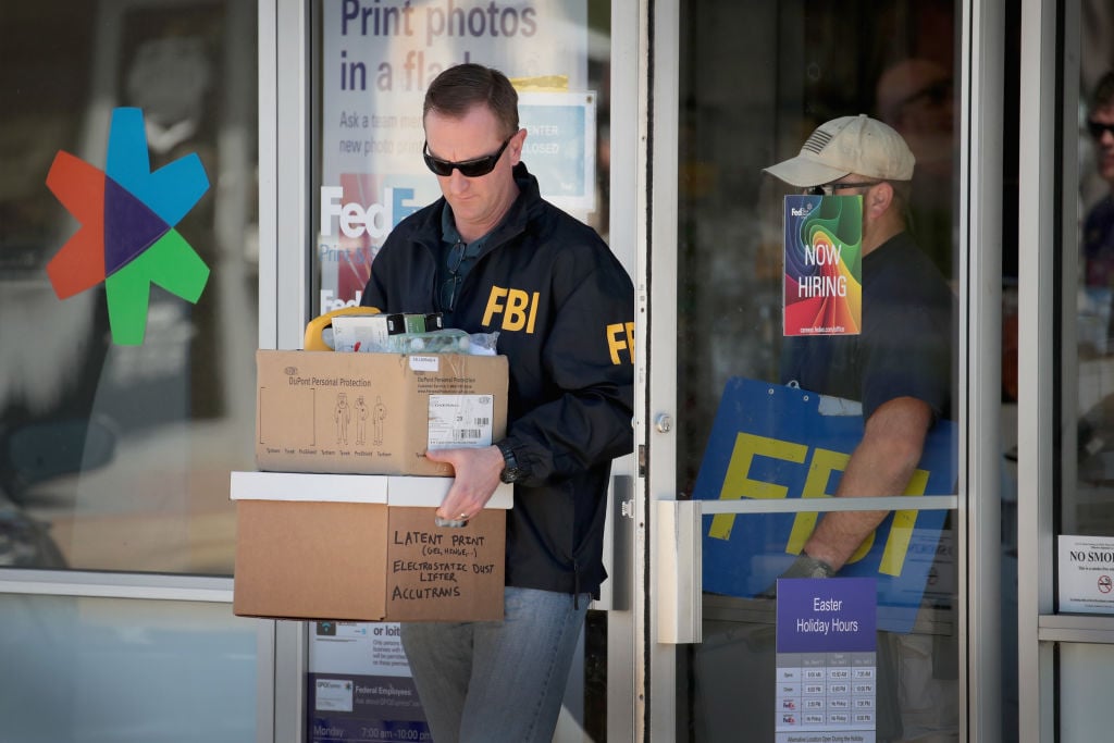 FBI Agents collect evidence in Austin FedEx bombing