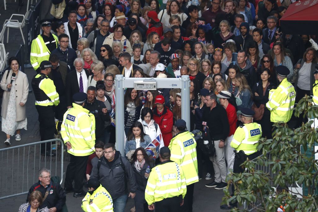 Members of the public pass a security screening as they arrive on castle hill ahead of the wedding and carriage procession of Britain's Prince Harry and Meghan Markle in Windsor, on May 19, 2018. Members of the public pass a security screening as they arrive on castle hill ahead of the wedding and carriage procession of Britain's Prince Harry and Meghan Markle in Windsor, on May 19, 2018.