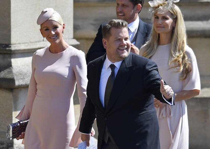 British presenter James Corden and Julia Carey arrive for the wedding ceremony of Britain's Prince Harry, Duke of Sussex and US actress Meghan Markle at St George's Chapel, Windsor Castle, in Windsor, on May 19, 2018. (Photo by TOBY MELVILLE / POOL / AFP) (Photo credit should read TOBY MELVILLE/AFP/Getty Images) British presenter James Corden and Julia Carey arrive for the wedding ceremony of Britain's Prince Harry, Duke of Sussex and US actress Meghan Markle at St George's Chapel, Windsor Castle, in Windsor, on May 19, 2018. (Photo by TOBY MELVILLE / POOL / AFP) (Photo credit should read TOBY MELVILLE/AFP/Getty Images)