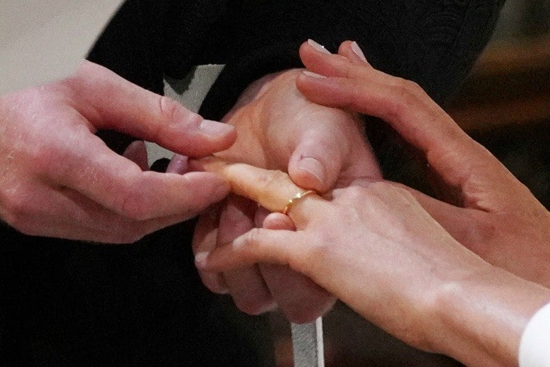 Prince Harry places ring on finger