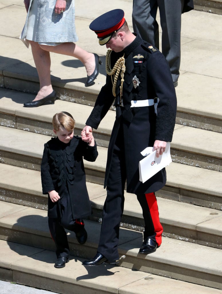 Prince William, Duke of Cambridge with Prince George leave St George's Chapel, Windsor Castle after the wedding of Prince Harry, Duke of Sussex and the Duchess of Sussex on May 19, 2018 in Windsor, England. Prince William, Duke of Cambridge with Prince George leave St George's Chapel, Windsor Castle after the wedding of Prince Harry, Duke of Sussex and the Duchess of Sussex on May 19, 2018 in Windsor, England.