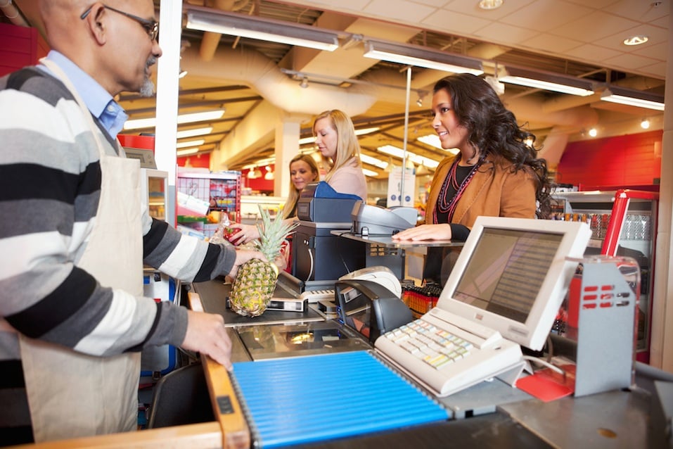 People check out at the grocery store.