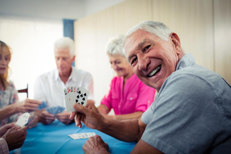 Group of seniors playing cards