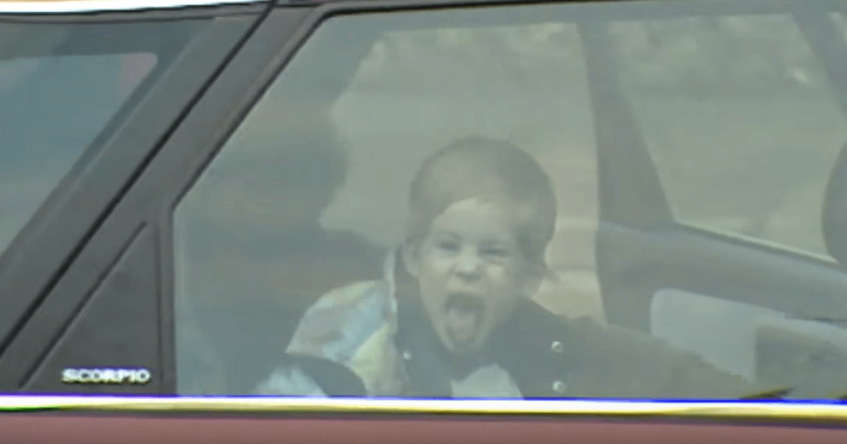 Prince Harry as a child sticks out tongue