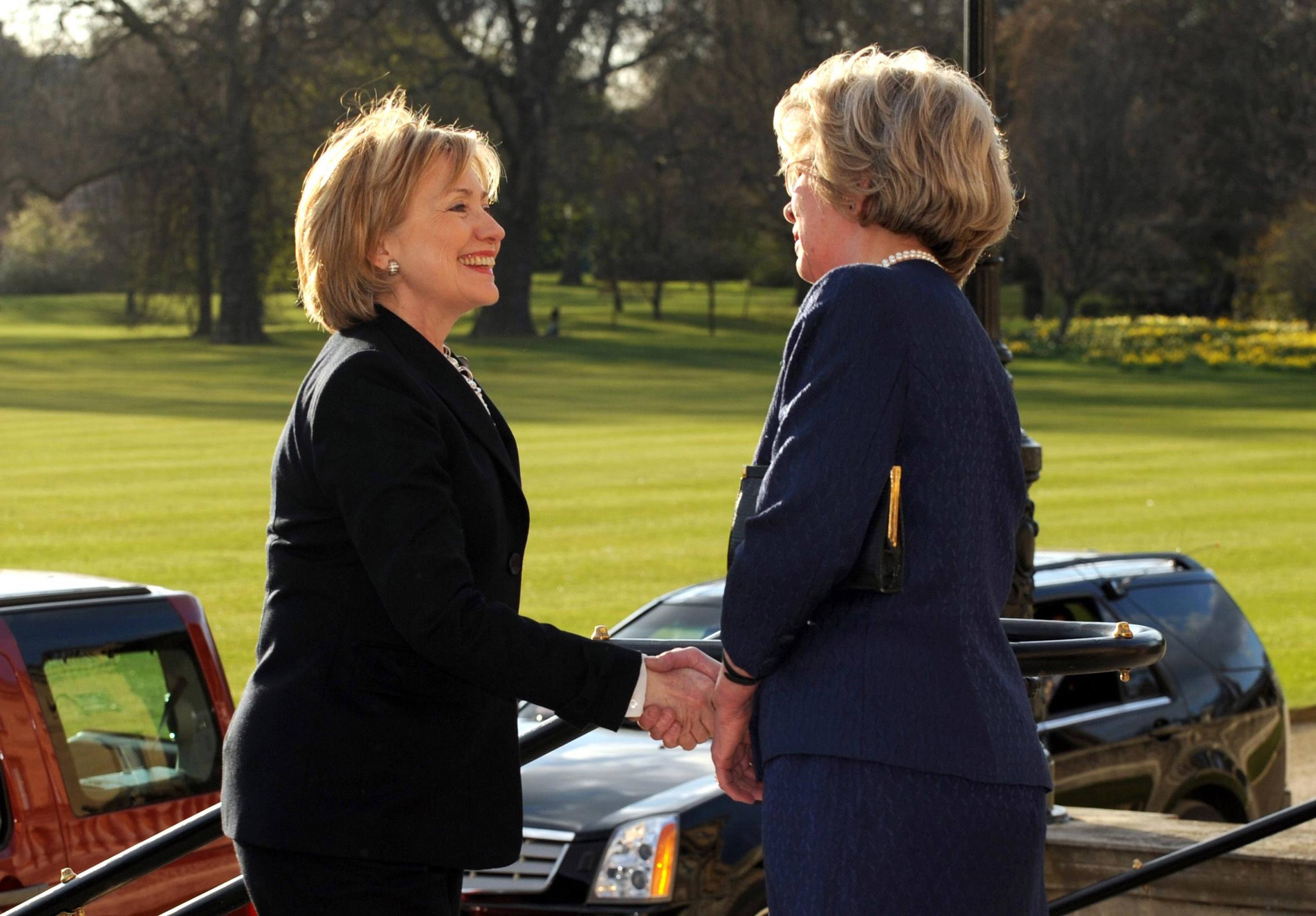 Secretary of State Hillary Clinton is greeted by Mrs Jennifer Gordon-Lennox, Lady In Waiting