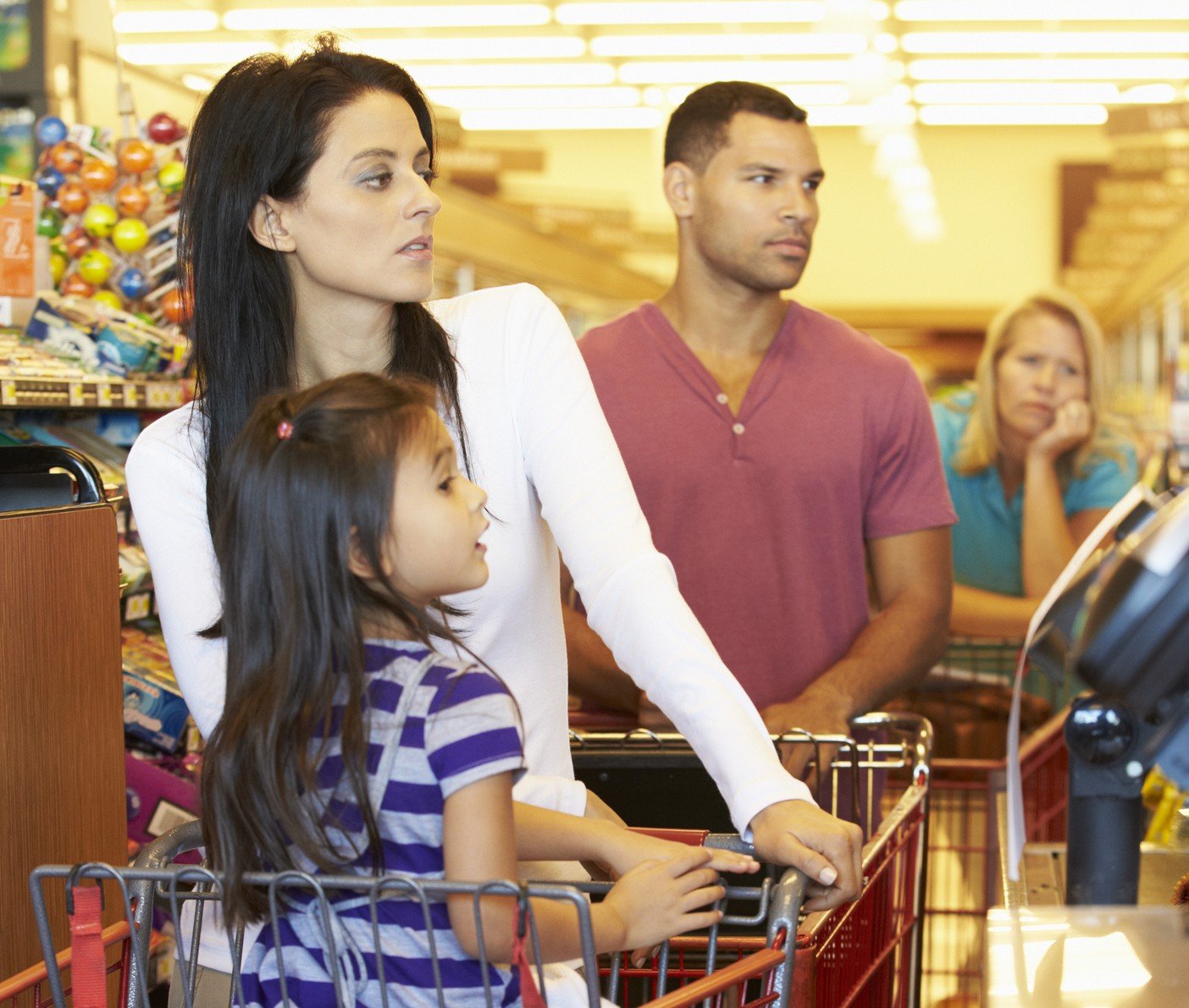 dollar store Customer In Queue To Pay For Shopping At Supermarket Checkout