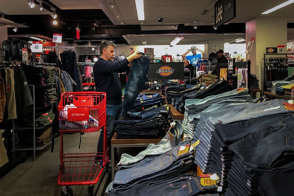 A man shops for jeans in a JCPenny store at the Manhattan Mall