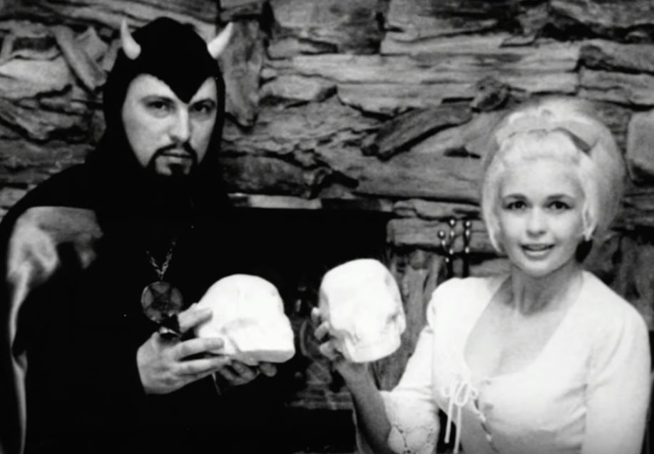 High priest of the Church of Satan poses with actress Jayne Mansfield.