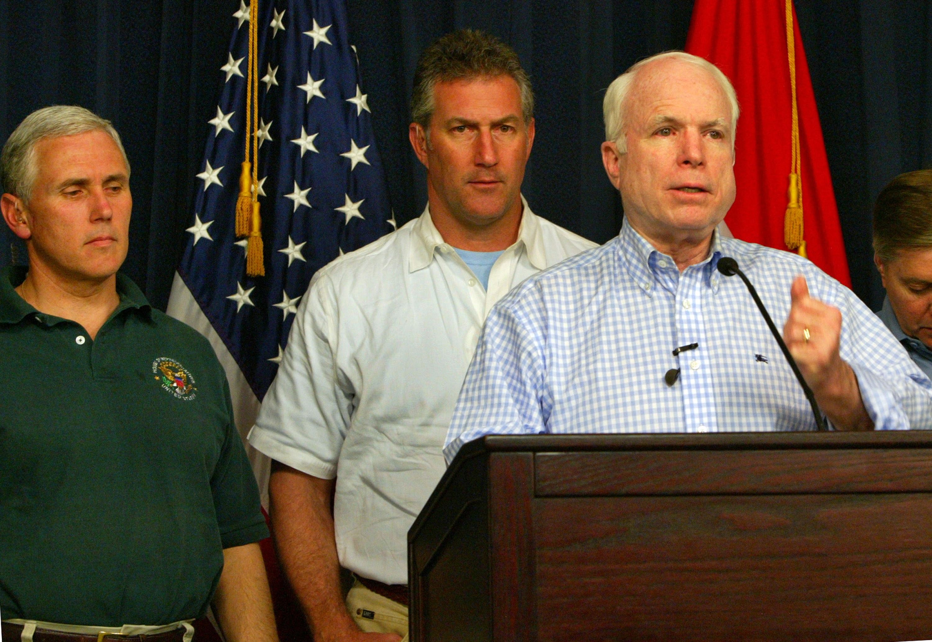 Rep. Mike Pence (R-IN) and Rep. Rick Renzi (R-AZ) look on in the fortified Green Zone April 1, 2007 in Baghdad, Iraq.