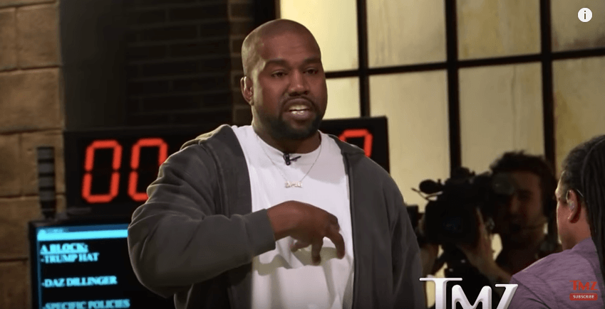 Kanye talking to TMZ for an interview Kanye talking to TMZ for an interview